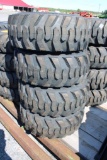 4- Forerunner 12-16.5 skid loader tires w/ case rims (x4)