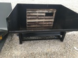 Forklift tipping dumpster, unused