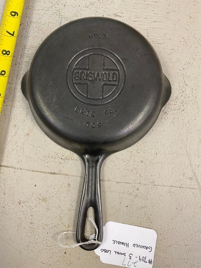 #709, 3 small logo Griswold Skillet, grooved handle