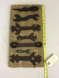 Assorted wrenches on display board