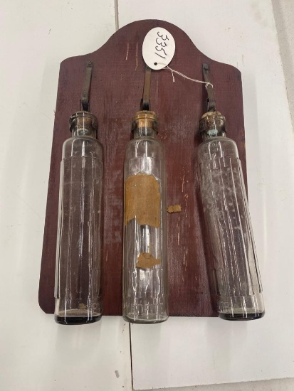 Set of 3 Pyrolite glass fire bottles on primitive board