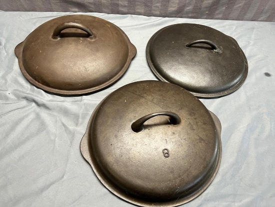 2- no. 8 cast iron skillet covers and 1 dutch oven lid