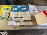 Large asst. of Ford/ New Holland Manuals and stickers