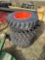 Set of 4 skid steer tires with rims