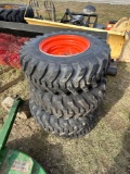 Set of 4 skid steer tires with rims
