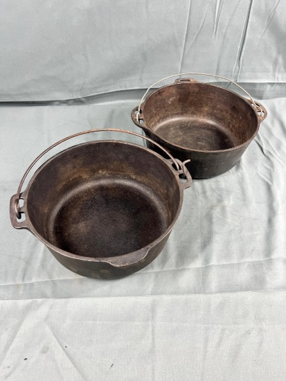 Pair of Griswold no. 8 Dutch Oven bottoms, one marked w/ Wagner as well, no lids