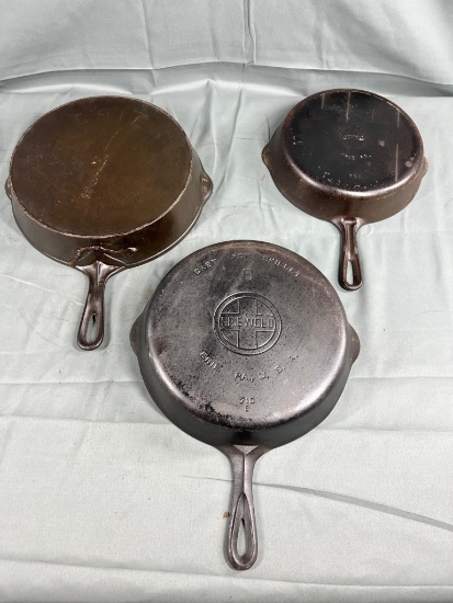 Griswold no. 9 Large Block (cracked) Skillet, REPAIRED no. 10 ERIE, and no. 7 Small Block (pitted)