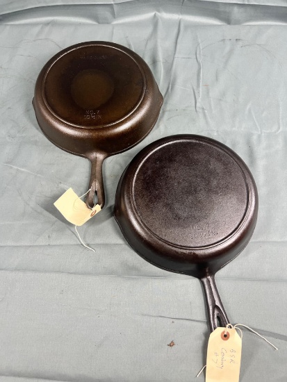 2- USA Made no. 7 cast iron skillets w/ heat rings
