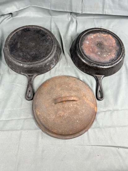 2- No. 8 Cast Iron Skillets, and no. 8 Dutch Oven lid
