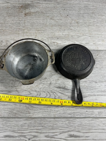 Griswold no. 0 Cast Iron Skillet and Griswold Self Service Dutch Oven bottom
