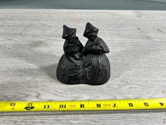 Cast Iron of 2 woman, 2 clappers