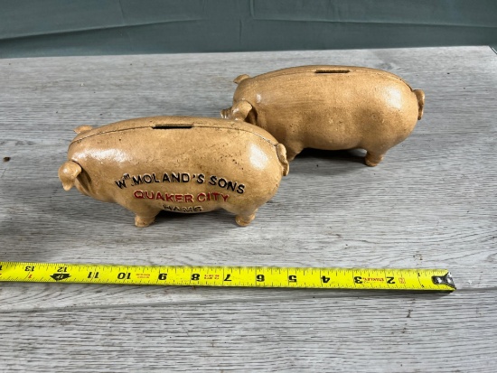2- Cast Iron Pig Banks, one marked Wm Moland's Sons Quaker City Hams