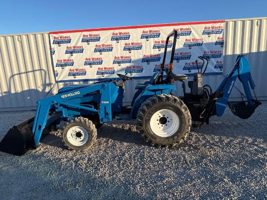 New Holland TC30 Tractor, bucket & backhoe 2278 hrs., SN 324596 on bucket