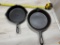 Bullseye Cast Iron Skillet top and Gatemarked Cast Iron Skillet (warped)