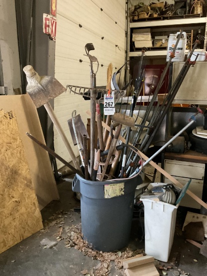 Barrel Of Garden Tools And Pipe Clamps
