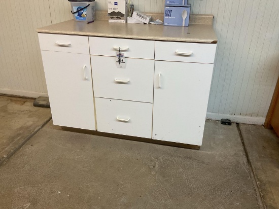 White Utility Storage Cabinet with Countertop and Contents