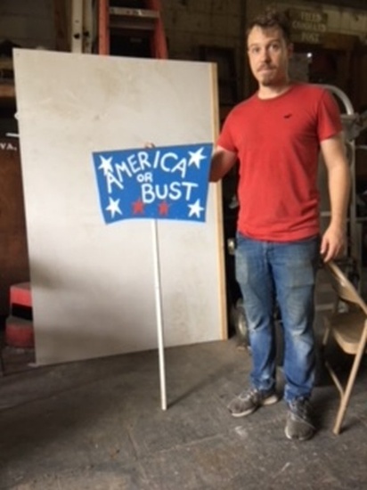 America or Bust Sign on a stick, measuring 22"W X 12"H Luan with Stick 4'