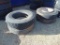 (2) 10.00-20 tires on rims, (1) 12r22.5 tire on rim, (1) 12r22.5 tire
