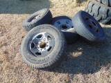 (4) assorted pickup tires on rims