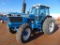 Ford TW25 FWD Farm Tractor, s/n 917654, cab, hour meter reads 6973 hrs, 3pt, 540 pto, 3 remotes