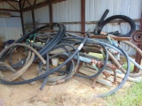 RACK OF ASSORTED SUCTION HOSES