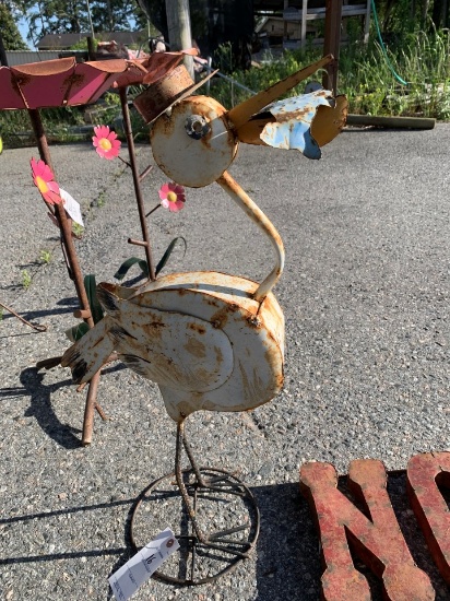 metal bird with fish in mouth