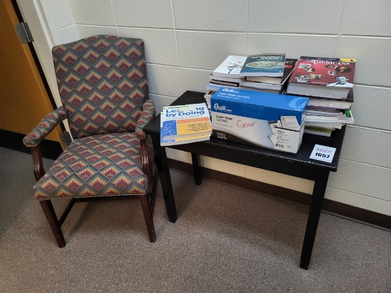 Office chair, wooden table, ink cartridge, books