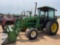 John Deere 2750 2wd Cab Tractor w 620 Loader Comes with Bucket and Hay Spear Cab Has Broken Door