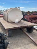 1000 gal. poly water tank on 4 wheel farm trailer. Non titled