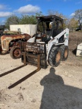 Bobcat 751 diesel with new tires, 3111 hours showing. Sold with pallet forks only - no bucket.
