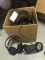 Box of Headphones and Charging Docks