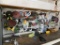 Contents of wall, top of work bench - grinding discs, sanding discs, safety glasses, hardware, tape