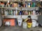 Contents of 2 shelves - lubricant, spray paint, straps, concrete curing blanket