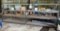 Large metal shelving without contents- 16.5 ft long, 4 ft tall