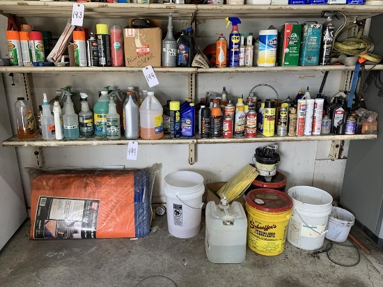 Contents of 2 shelves - lubricant, spray paint, straps, concrete curing blanket
