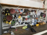 Contents of wall, top of work bench - grinding discs, sanding discs, safety glasses, hardware, tape
