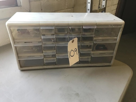 storage bin of miscellaneous hardware (push pins, straight pins, paper clips, suction cups)