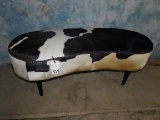 BLACK AND WHITE COWHIDE BENCH
