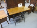 Repurposed sewing machine treadle table