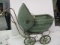 green wicker Victorian style baby carriage