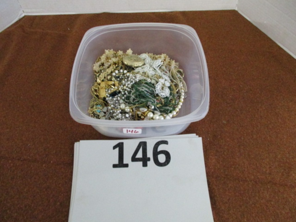 container of costume jewelry