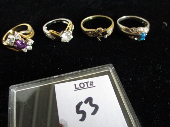 4 costume jewelry rings