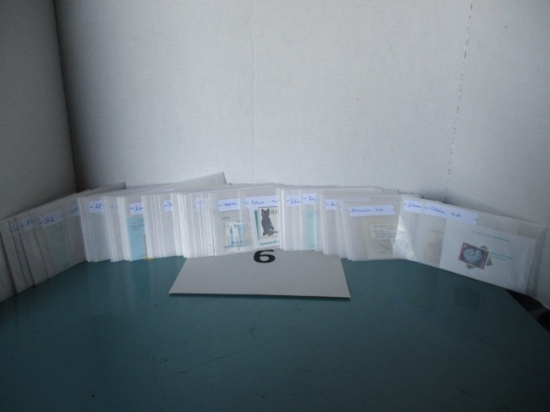 100 glassine envelopes full of stamps
