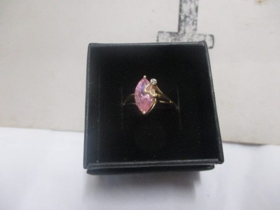 10 K yellow gold with pink CZ stone and diamond accent