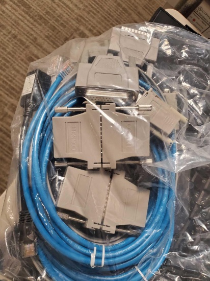 Bin of Miscellaneous Network Cables and Older Memory Sticks