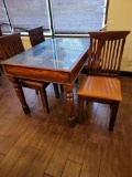 INDIA PANELED DOOR WITH METAL ACCENTS TURNED INTO TABLE WITH 4 CHAIRS
