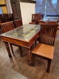 INDIA PANELED DOOR WITH METAL ACCENTS TURNED INTO TABLE WITH 4 CHAIRS