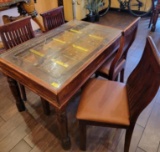 INDIA PANELED DOOR WITH METAL ACCENTS TURNED INTO TABLE WITH 4 CHAIRS