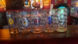 5 LARGE BEER GLASSES AND 2 FLAGS