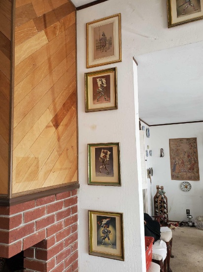 ARTWORK COLLECTION IN UPSTAIRS LIVING ROOM.